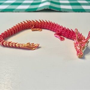 Coral / orangeish gold dragon toy